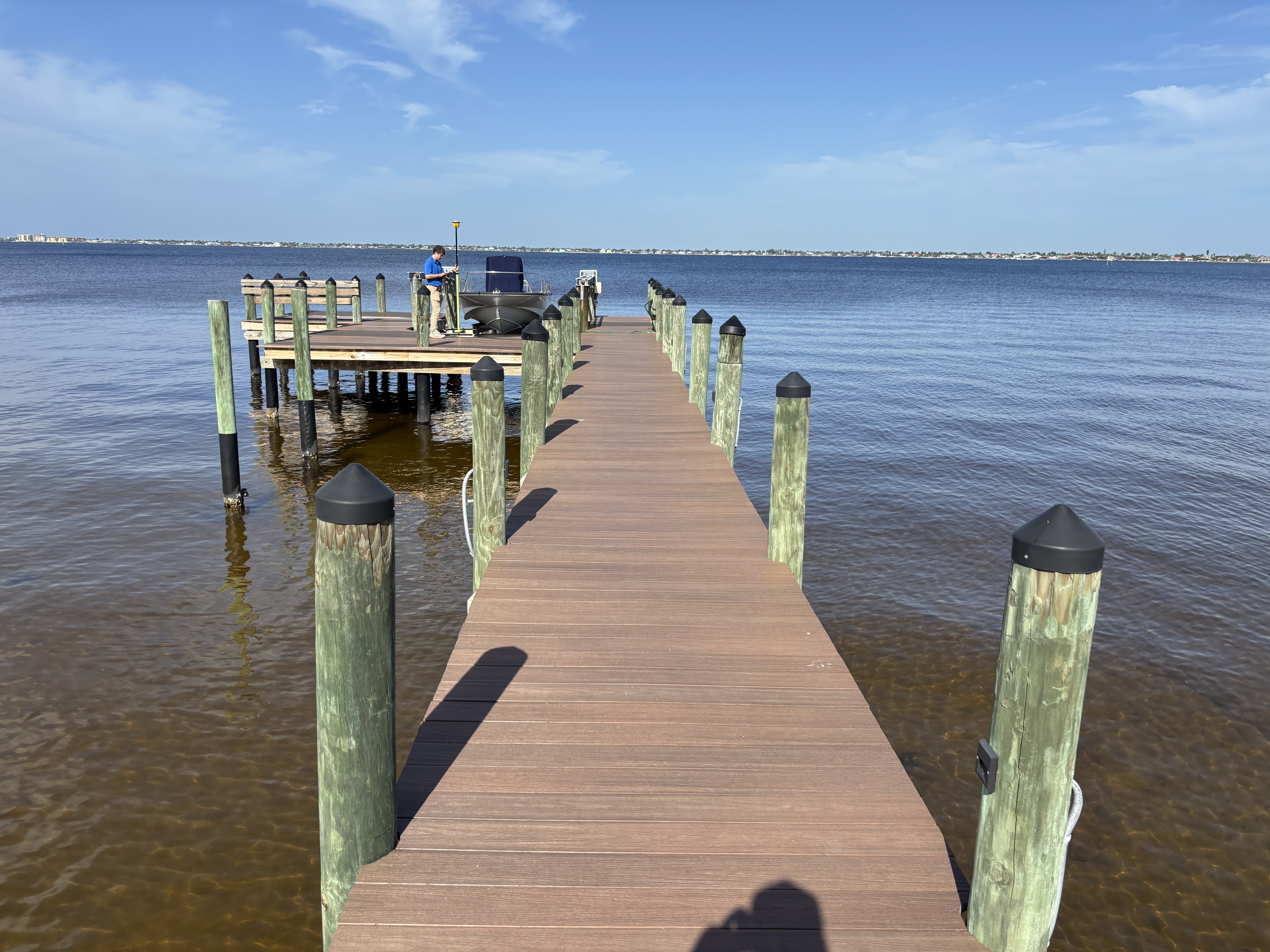 Marina restoration project — dock construction in a Florida bay, with new decking and pilings